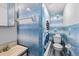 Retro bathroom featuring charming blue tile work, clean fixtures, and classic design that adds character at 2224 Gordon St, Tampa, FL 33605