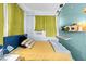 Bright bedroom with a comfortable bed, colorful decor, and unique, personal touches creating a cozy atmosphere at 2224 Gordon St, Tampa, FL 33605