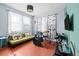 Bedroom space with natural light, playful decor, and a cozy daybed provides a comfortable retreat at 2224 Gordon St, Tampa, FL 33605