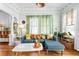 Bright and inviting living room with hardwood floors, comfortable seating, and eye-catching decor at 2224 Gordon St, Tampa, FL 33605