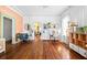 Bright living room featuring hardwood floors, decorative ceilings, and a separate office area at 2224 Gordon St, Tampa, FL 33605