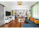 Open-concept living area with hardwood floors, stylish decor, and plenty of natural light at 2224 Gordon St, Tampa, FL 33605