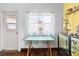 Brightly lit room with table and chairs next to a window at 2224 Gordon St, Tampa, FL 33605