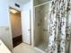 Shower stall in the bathroom with glass doors and tile walls at 2253 Norwegian Dr # 63, Clearwater, FL 33763
