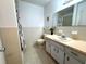 Cozy bathroom with a neutral-colored tile and cabinets at 2253 Norwegian Dr # 63, Clearwater, FL 33763