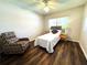 Bedroom with hardwood floors and a recliner at 2253 Norwegian Dr # 63, Clearwater, FL 33763