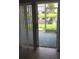 Tile floor in room with sliding glass doors providing access to a screen patio with pond view at 244 Countryside Key Blvd, Oldsmar, FL 34677