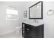 Charming bathroom with black and white mosaic tile flooring and powder room sign at 2635 13Th N Ave, St Petersburg, FL 33713