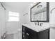 Charming bathroom with a modern vanity, black hardware, and a patterned tile floor at 2635 13Th N Ave, St Petersburg, FL 33713