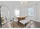 Chic dining room with a unique mirror, modern light fixture, and oversized rug at 2635 13Th N Ave, St Petersburg, FL 33713