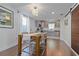 Dining area features hardwood floors, modern table and seating, and a seamless flow into the kitchen at 2635 13Th N Ave, St Petersburg, FL 33713