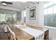 Bright dining room boasts a hardwood table, and flows into the living room with ample natural light at 2635 13Th N Ave, St Petersburg, FL 33713
