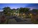 A well-lit home with a landscaped yard, complemented by a gazebo and wood-framed covered parking at 2635 13Th N Ave, St Petersburg, FL 33713