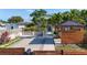 Wide home exterior shot with a manicured lawn and garden area and wooden fence at 2635 13Th N Ave, St Petersburg, FL 33713