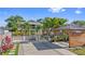 A well-lit home with a landscaped yard, complemented by a gazebo and wood-framed covered parking at 2635 13Th N Ave, St Petersburg, FL 33713