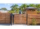 Charming home exterior with a wooden fence, a manicured landscape, and a mailbox at 2635 13Th N Ave, St Petersburg, FL 33713