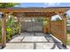 Outdoor gazebo with wooden beams and posts, a concrete paver floor, and a cozy ambiance at 2635 13Th N Ave, St Petersburg, FL 33713