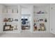 Stylish hallway with decorative shelving leading to a bright, sunlit office space at 2635 13Th N Ave, St Petersburg, FL 33713