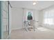 Well-lit home office featuring a stand-up desk, comfortable chair, and an abundance of natural light at 2635 13Th N Ave, St Petersburg, FL 33713