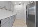 Clean kitchen features sleek countertops, stainless steel refrigerator, and abundant storage cabinets at 2635 13Th N Ave, St Petersburg, FL 33713