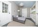 Covered balcony with outdoor seating area and a view of the outdoors and a white railing at 2635 13Th N Ave, St Petersburg, FL 33713