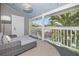 Serene covered balcony with comfortable seating and views of lush tropical foliage at 2635 13Th N Ave, St Petersburg, FL 33713