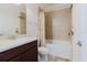 Cozy bathroom with a single vanity, mirror, and tub with shower combination at 27094 Carolina Astor, Wesley Chapel, FL 33544