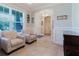 Cozy living room featuring neutral decor, and large windows which provide an abundance of natural light at 27094 Carolina Astor, Wesley Chapel, FL 33544