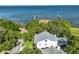 Aerial view of waterfront home with dock and beautiful views of the ocean at 2802 Old Bayshore Way, Tampa, FL 33611
