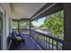 Inviting balcony with comfortable seating offers picturesque views of the water and surrounding landscape at 2802 Old Bayshore Way, Tampa, FL 33611