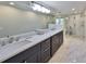 Beautiful bathroom features dual sinks, a spacious shower, and elegant finishes with natural light at 2802 Old Bayshore Way, Tampa, FL 33611