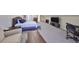 Expansive bedroom featuring a seating area, desk, media center, and a plush king-size bed at 2802 Old Bayshore Way, Tampa, FL 33611