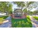 Exterior view of 'Old Bayshore Point' showing the sign, landscaping, and street at 2802 Old Bayshore Way, Tampa, FL 33611