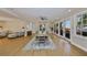 Spacious dining area with natural light, elegant wooden furniture, and serene outdoor views at 2802 Old Bayshore Way, Tampa, FL 33611