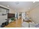Bright living area with large TV and comfortable seating at 2802 Old Bayshore Way, Tampa, FL 33611