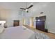 Bright and airy main bedroom has hardwood floors, a ceiling fan, and neutral colors for a calming atmosphere at 2802 Old Bayshore Way, Tampa, FL 33611