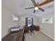 Bright office featuring a ceiling fan, backyard views, and classic wood furniture and built-in storage at 2802 Old Bayshore Way, Tampa, FL 33611