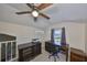Bright office featuring a ceiling fan, lake views, and classic wood furniture and built-in storage at 2802 Old Bayshore Way, Tampa, FL 33611