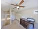 Office featuring a ceiling fan, hall access, and classic wood furniture and built-in storage at 2802 Old Bayshore Way, Tampa, FL 33611