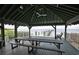 A covered pavilion with picnic tables, perfect for outdoor gatherings and enjoying the surrounding water views at 2802 Old Bayshore Way, Tampa, FL 33611