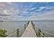 A long pier stretching out into the water, offering stunning waterfront views and access to the serene sea at 2802 Old Bayshore Way, Tampa, FL 33611