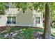 The backyard has lush landscaping and shade trees at 2915 Royal Tuscan Ln, Valrico, FL 33594