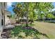 A sprawling lawn extends from the patio, framed by lush trees for privacy at 2915 Royal Tuscan Ln, Valrico, FL 33594