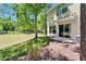This backyard offers a serene view with a well-maintained lawn and trees at 2915 Royal Tuscan Ln, Valrico, FL 33594
