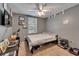 This cozy bedroom features a neutral color palette and is equipped with a ceiling fan and window for natural light at 2915 Royal Tuscan Ln, Valrico, FL 33594