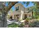 Charming two-story townhome featuring attached garage and lovely landscaping at 2915 Royal Tuscan Ln, Valrico, FL 33594