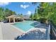 Inviting pool with surrounding brick pavers and a charming covered lounge area at 2915 Royal Tuscan Ln, Valrico, FL 33594