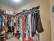 Spacious walk-in closet with ample storage space, shelving, and rods for hanging clothes and accessories at 2915 Royal Tuscan Ln, Valrico, FL 33594