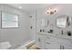Elegant bathroom with dual vanity, subway tile shower, stylish fixtures, and marble-like tile floors at 3000 19Th S Ave, St Petersburg, FL 33712