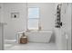 Stylish bathroom with a deep soaking tub, walk-in shower, modern fixtures, and a serene atmosphere at 3000 19Th S Ave, St Petersburg, FL 33712